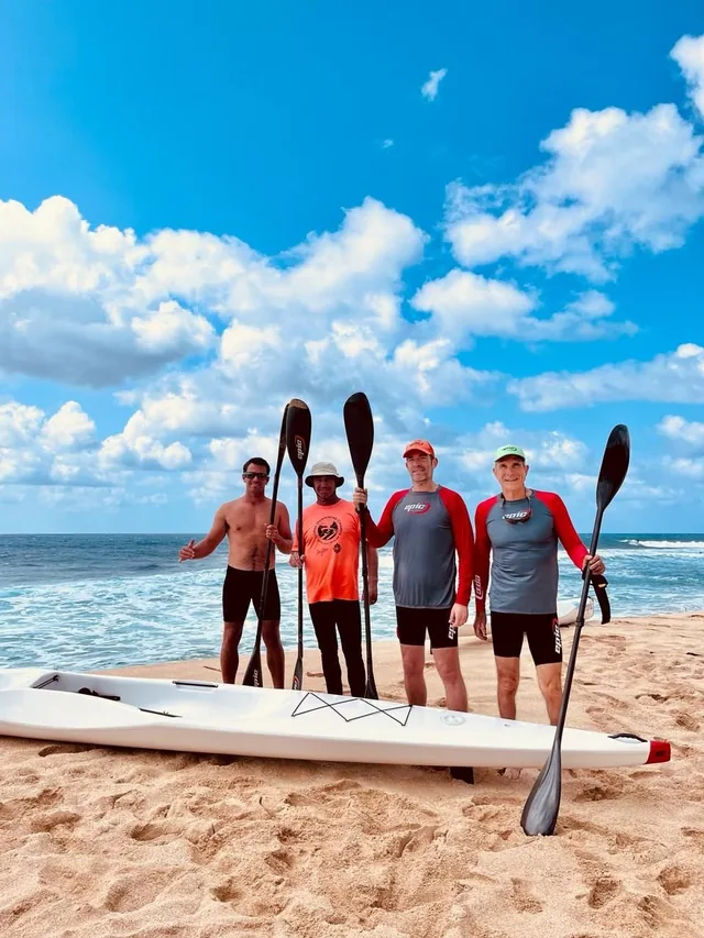 Paddlers on the beach with their Epic skis
