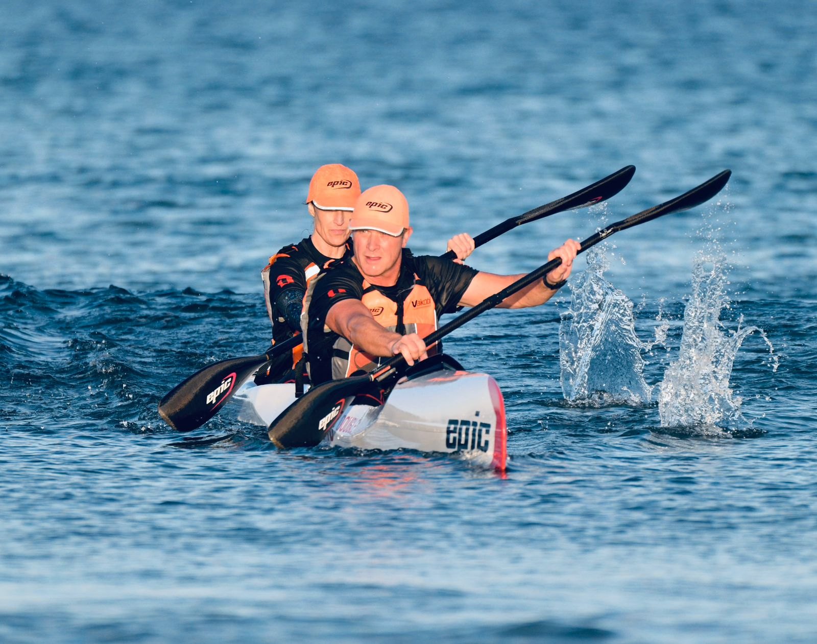 Two paddlers driving an Epic double surfski