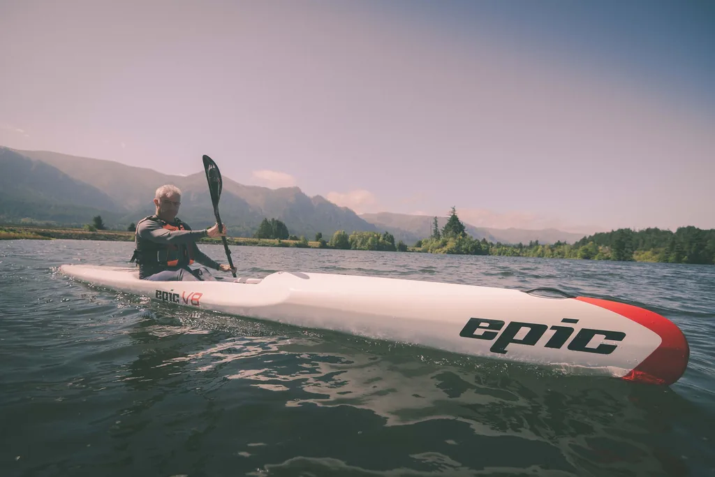 A paddler on an Epic on calm water