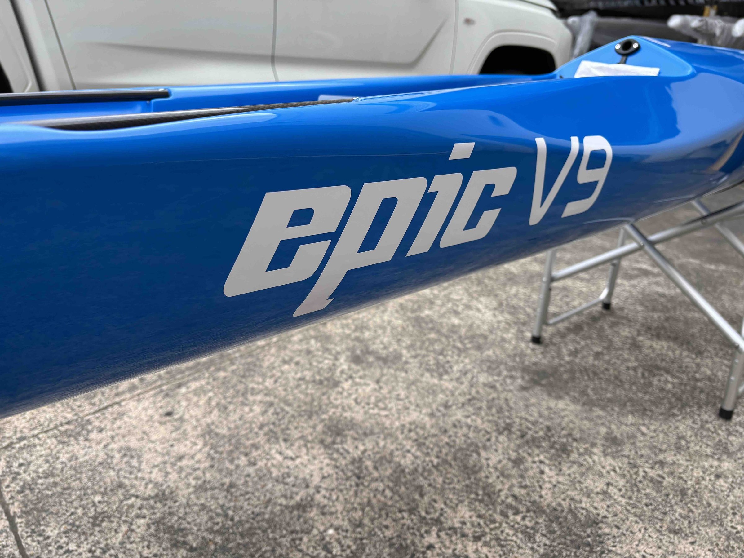 A blue Epic V9 Generation 2 on a boat stand